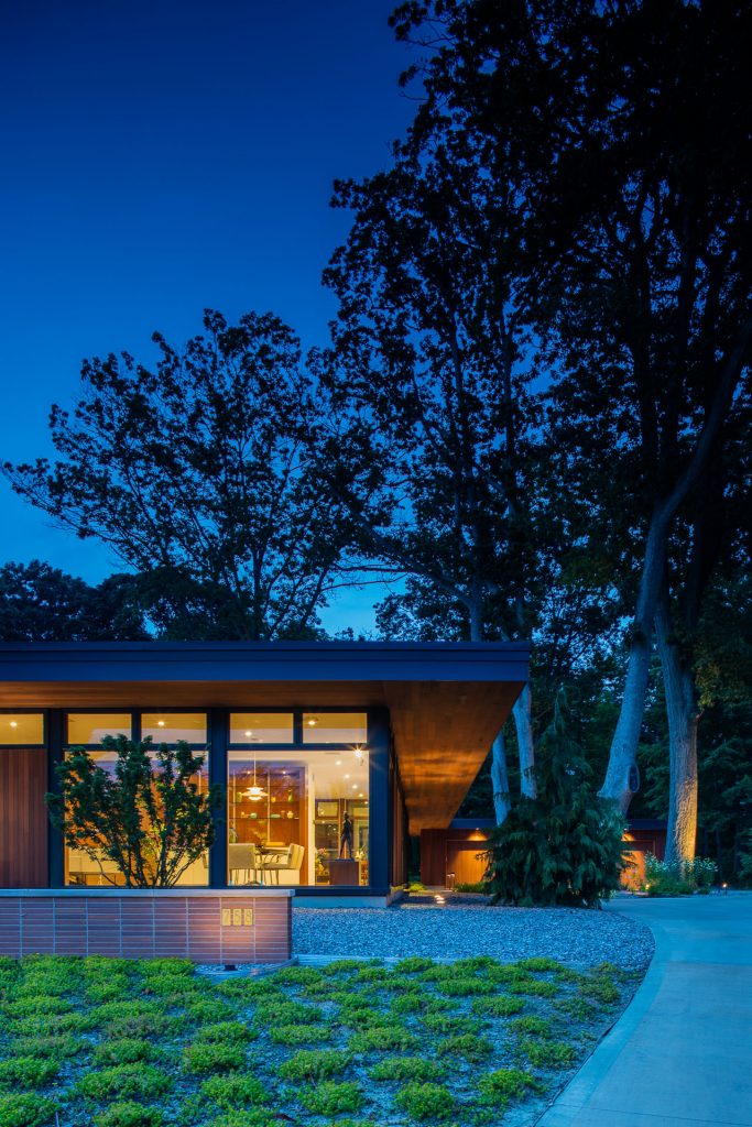 saugatuck mid century modern home plan design warm roof overhang windows west michigan