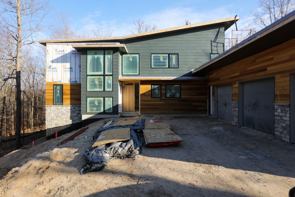 Front view of Modern Rouge River Residence by Grand Rapids Lucid Architecture